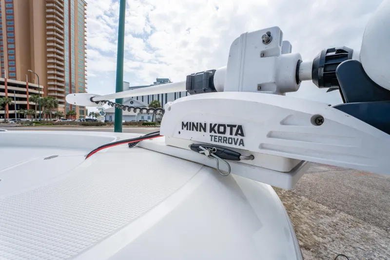 Slide: The Image of Minn Kota Terrova trolling motor on 2021 Wellcraft 221 Bay boat, urban backdrop. - 17