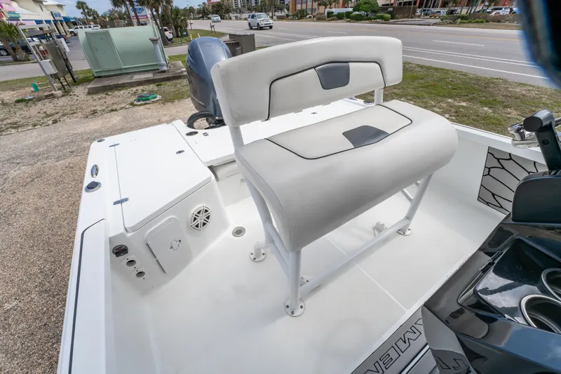 Slide: The Image of 2021 Wellcraft 221 Bay boat interior with cushioned seating and storage compartments. - 18