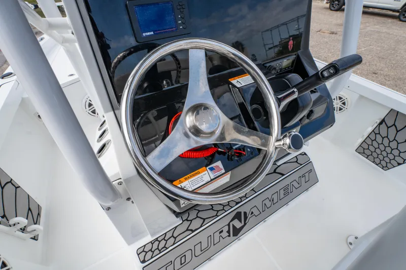 Slide: The Image of Steering console of 2021 Wellcraft 221 Bay boat with modern controls and tournament mat. - 20