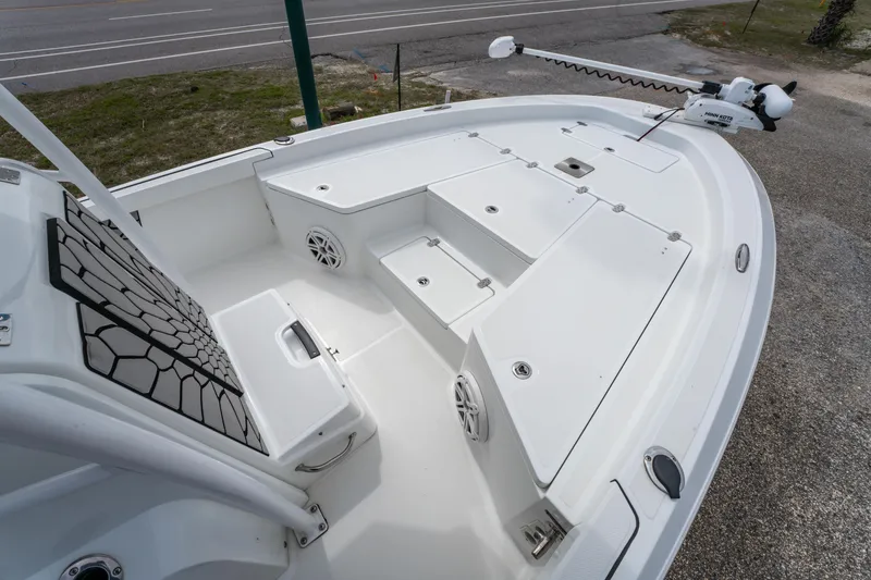 Slide: The Image of 2021 Wellcraft 221 Bay boat deck with storage compartments and speakers. - 24