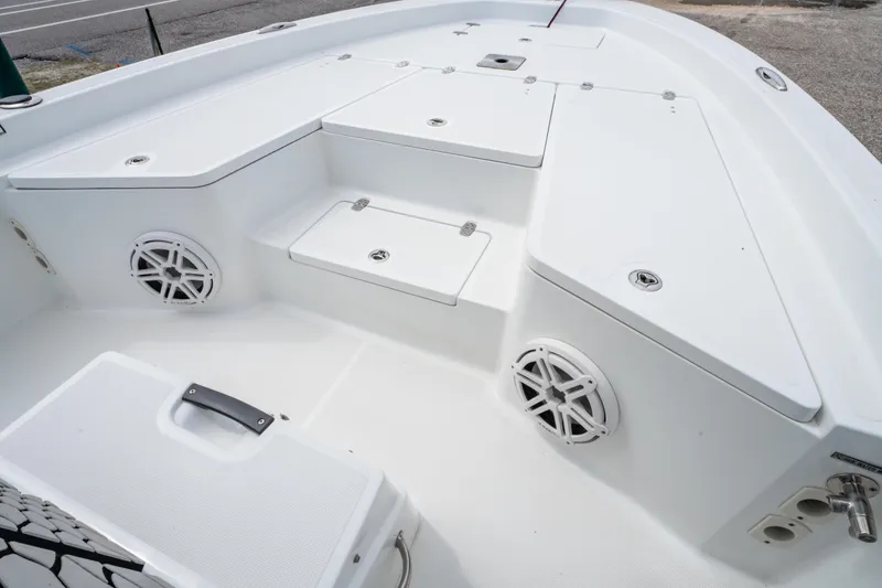 Slide: The Image of 2021 Wellcraft 221 Bay boat deck with storage compartments and speakers. - 25