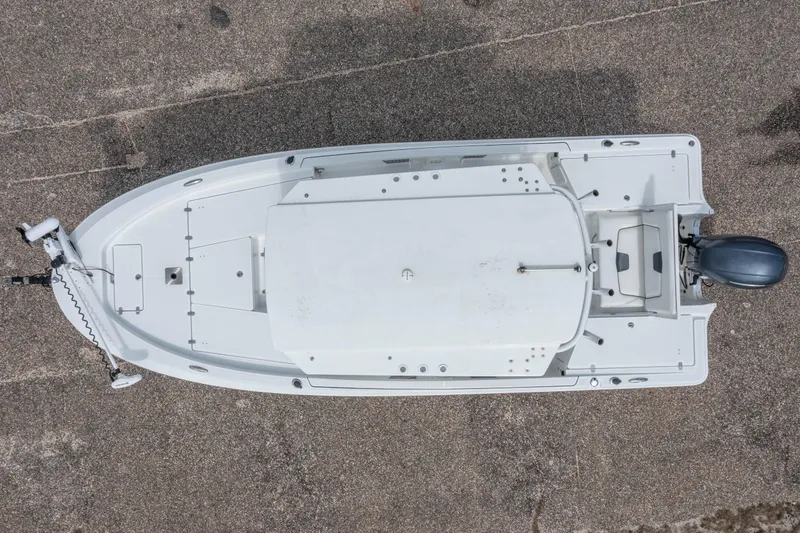 Slide: The Image of Overhead view of a 2021 Wellcraft 221 Bay boat on a textured surface. - 9