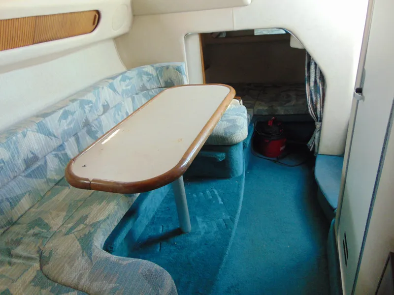 Slide: The Image of Interior of 1995 Sea Ray 290DA boat with seating and table. - 10
