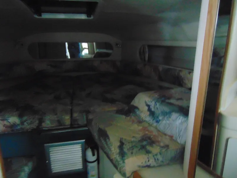 Slide: The Image of Interior cabin of a 1995 Sea Ray 290DA boat with patterned upholstery. - 12