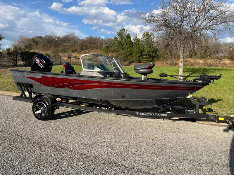 Slide: The Image of 2021 Ranger VS1782 WT fishing boat on trailer, parked outdoors. - 14