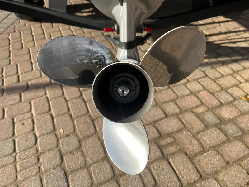 Slide: The Image of 2021 Ranger VS1782 WT boat propeller on a cobblestone surface. - 17