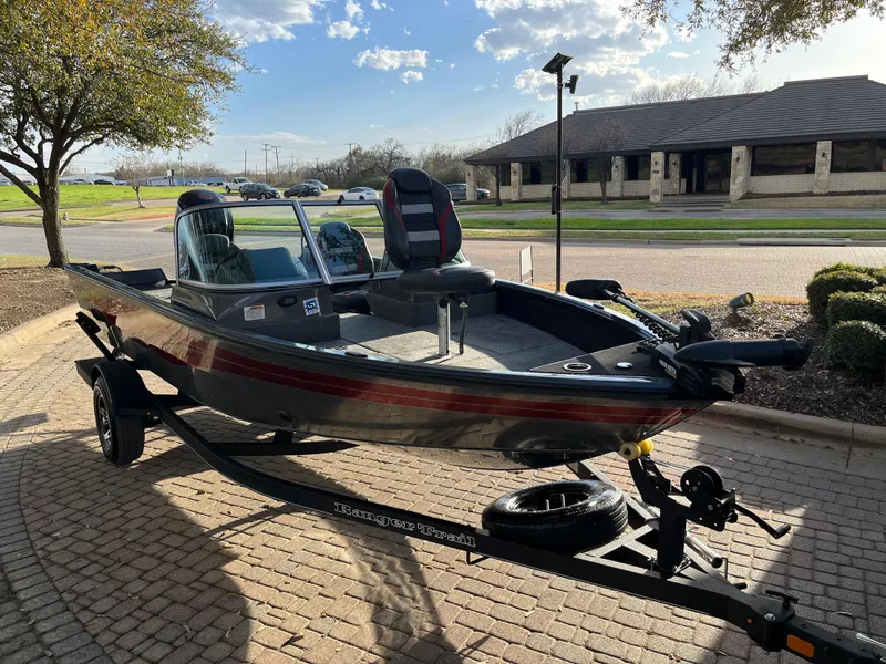 Slide: The Image of 2021 Ranger VS1782 WT fishing boat on trailer, parked outdoors. - 19