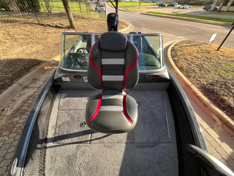 Slide: The Image of 2021 Ranger VS1782 WT boat interior with a central seat and carpeted deck. - 26