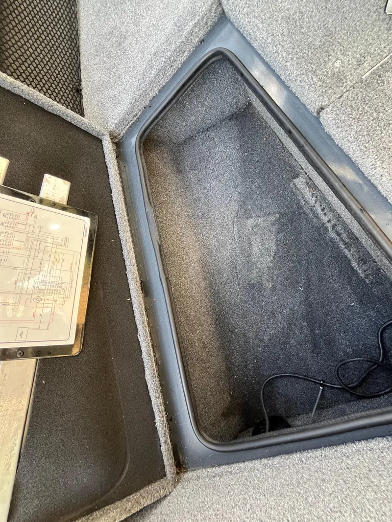 Slide: The Image of 2021 Ranger VS1782 WT boat storage compartment with carpeted interior. - 30