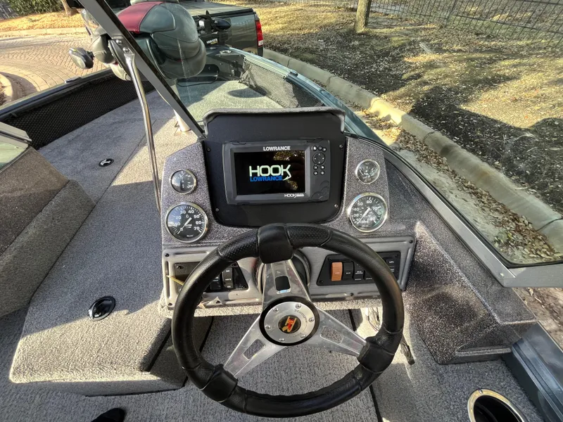 Slide: The Image of 2021 Ranger VS1782 WT boat dashboard with steering wheel and Lowrance Hook display. - 35