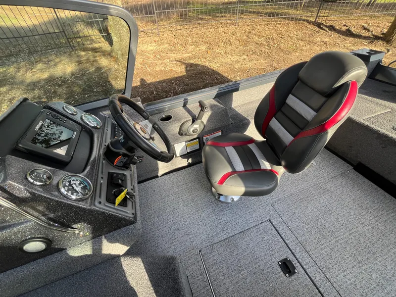 Slide: The Image of 2021 Ranger VS1782 WT boat interior with steering wheel and cushioned seat. - 36