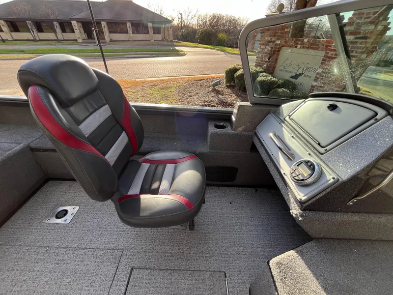 Slide: The Image of 2021 Ranger VS1782 WT boat interior with black and red seat, dashboard view. - 37
