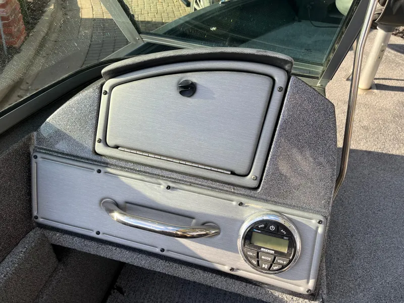 Slide: The Image of 2021 Ranger VS1782 WT boat dashboard with storage compartment and control panel. - 39