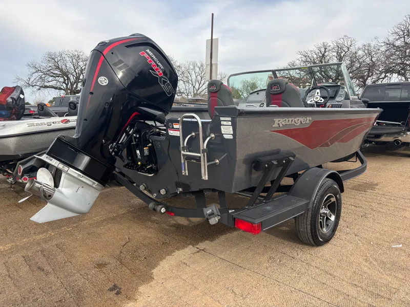 Slide: The Image of 2021 Ranger VS1782 WT boat with powerful outboard motor, parked on a trailer. - 4