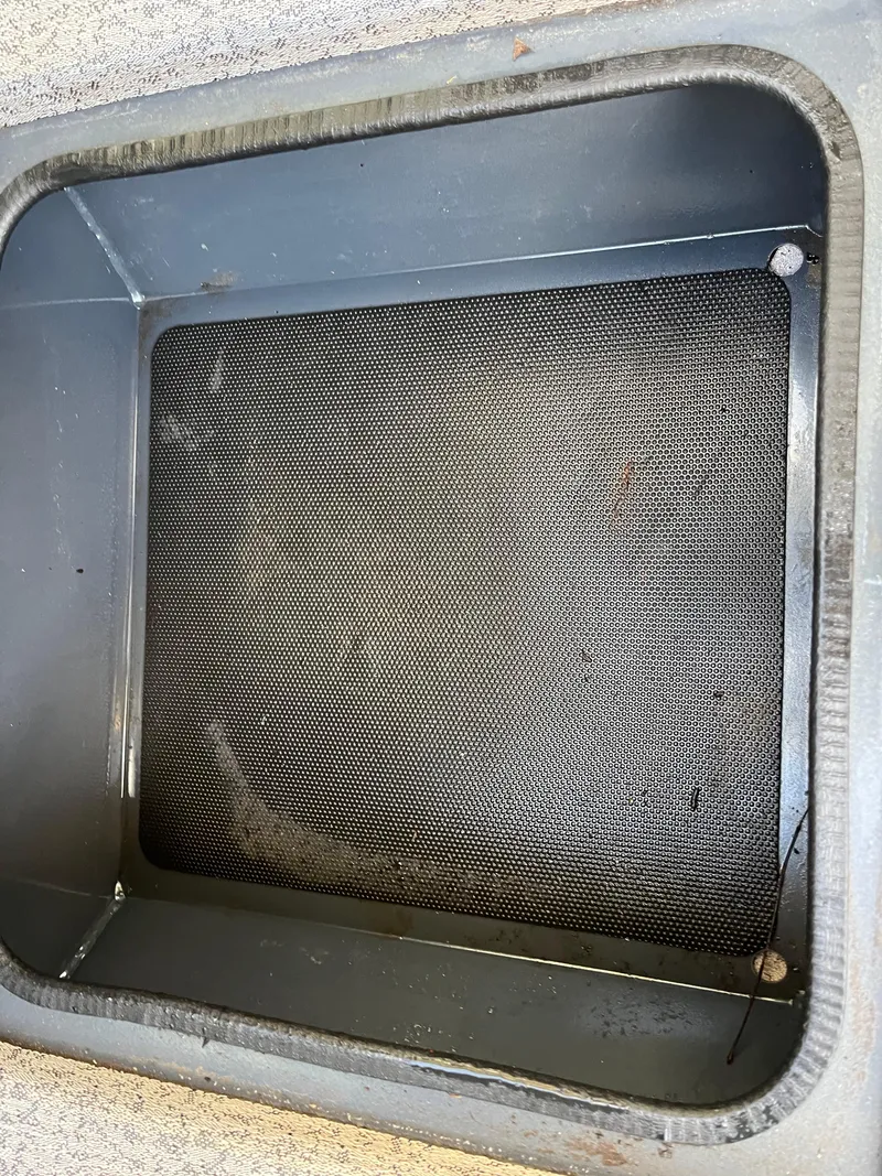 Slide: The Image of 2021 Ranger VS1782 WT boat compartment with black mesh lining. - 42