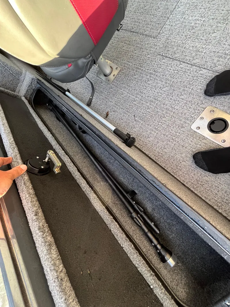 Slide: The Image of 2021 Ranger VS1782 WT boat storage compartment with fishing rod holder. - 43