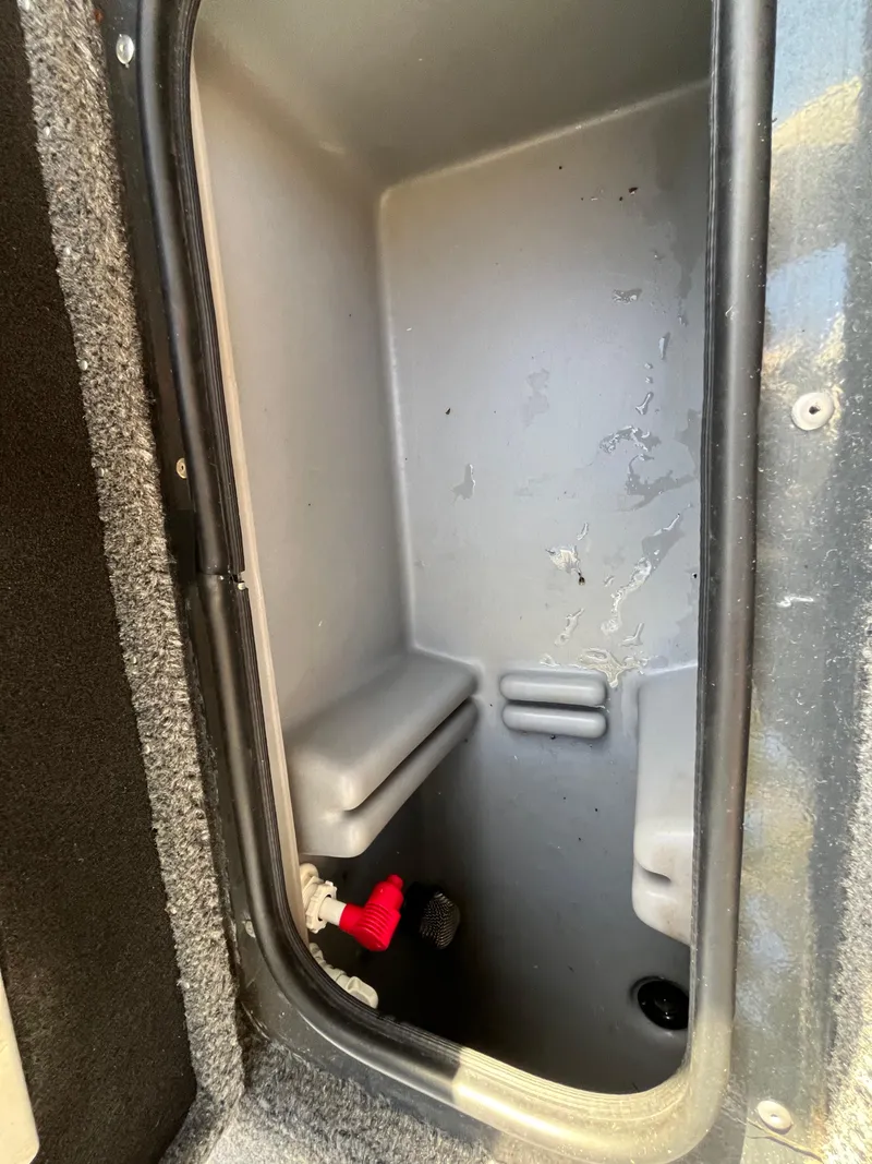 Slide: The Image of Storage compartment of 2021 Ranger VS1782 WT boat, featuring a clean interior. - 47
