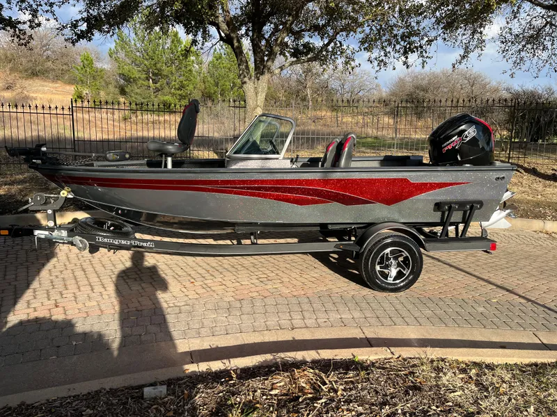 Slide: The Image of 2021 Ranger VS1782 WT fishing boat on trailer, parked outdoors. - 5