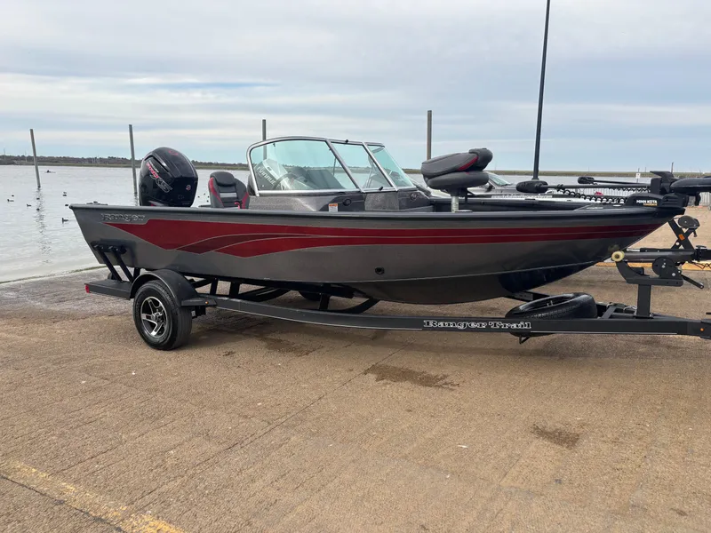 Slide: The Image of 2021 Ranger VS1782 WT fishing boat on trailer by the water. - 7