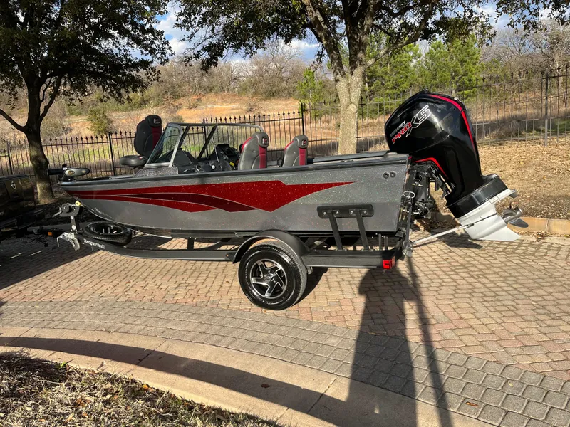 Slide: The Image of 2021 Ranger VS1782 WT fishing boat with outboard motor on a trailer. - 9