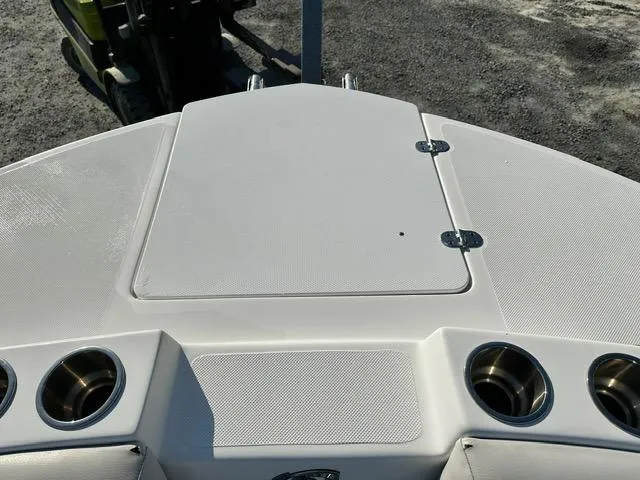 Slide: The Image of 2018 Godfrey Hurricane 217SD boat deck with cup holders and storage compartment. - 13