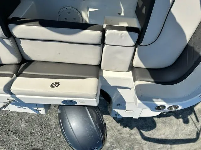 Slide: The Image of 2018 Godfrey Hurricane 217SD boat interior with cushioned seating and outboard motor. - 16