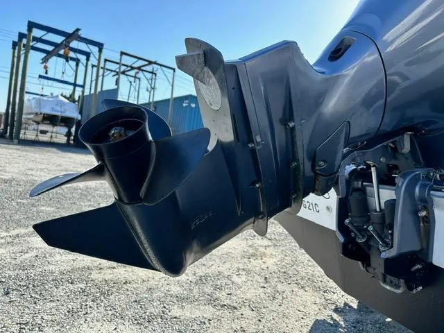 Slide: The Image of Close-up of a 2018 Godfrey Hurricane 217SD boat propeller in a marina setting. - 19