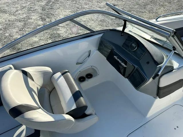Slide: The Image of 2018 Godfrey Hurricane 217SD boat interior with steering wheel and seating. - 4