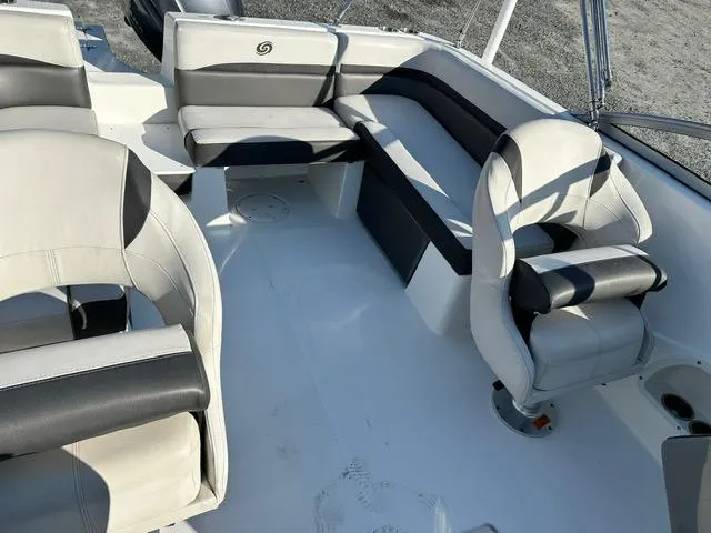 Slide: The Image of 2018 Godfrey Hurricane 217SD boat interior with white and black seating arrangement. - 6