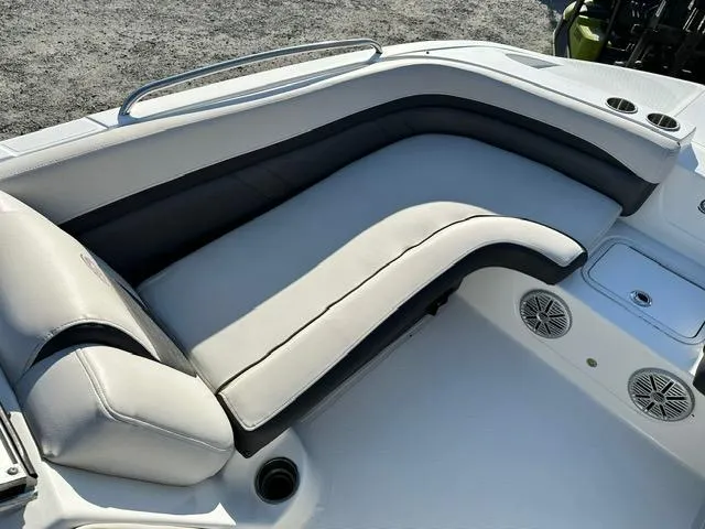 Slide: The Image of 2018 Godfrey Hurricane 217SD boat interior with cushioned seating and cup holders. - 9