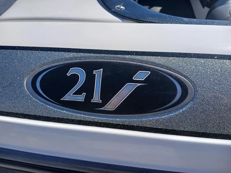 Slide: The Image of Skeeter 21 boat emblem, 2006 model, featuring sleek design and metallic finish. - 14