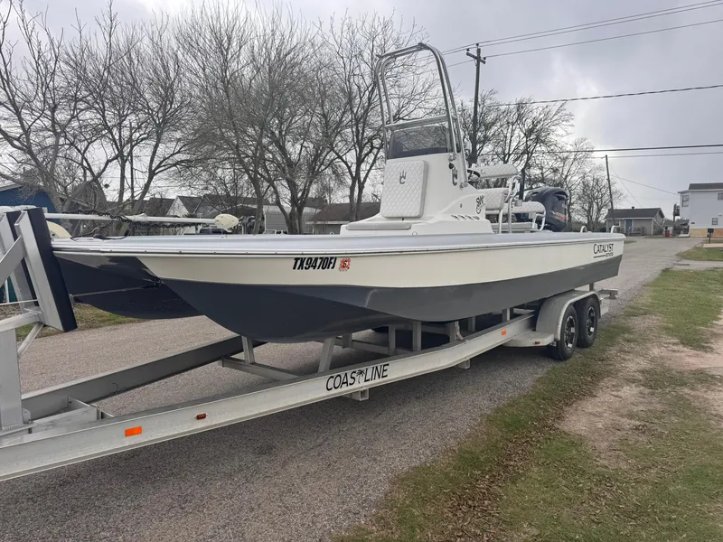 The Image of 2019 Catalyst 260 Catamaran on trailer, parked on a residential street. - 0