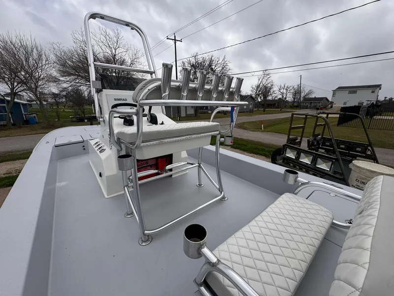 Slide: The Image of 2019 Catalyst 260 Catamaran boat interior with seating and rod holders. - 5