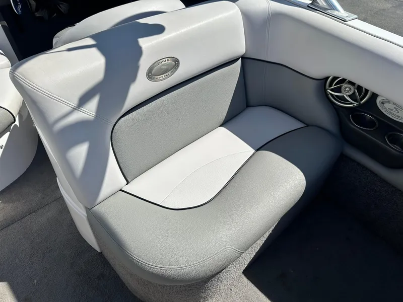 Slide: The Image of 2008 Supra Launch 24 SSV GG Edition boat interior with gray seating and speaker detail. - 8