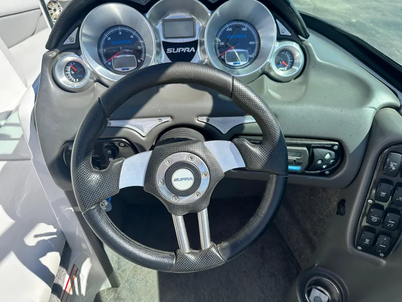 Slide: The Image of 2008 Supra Launch 24 SSV GG Edition dashboard with steering wheel and gauges. - 9