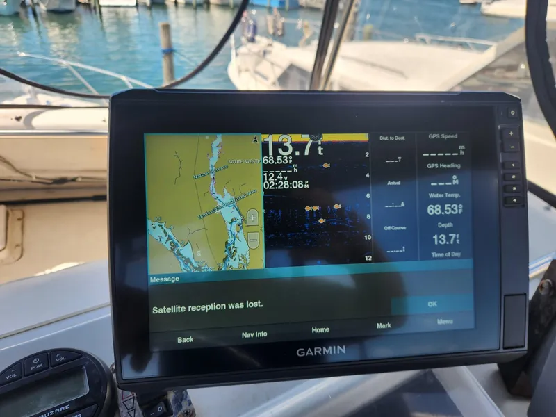 Slide: The Image of Garmin navigation screen on 1977 Pacemaker 40 Sportfisherman, displaying map and satellite reception alert. - 10