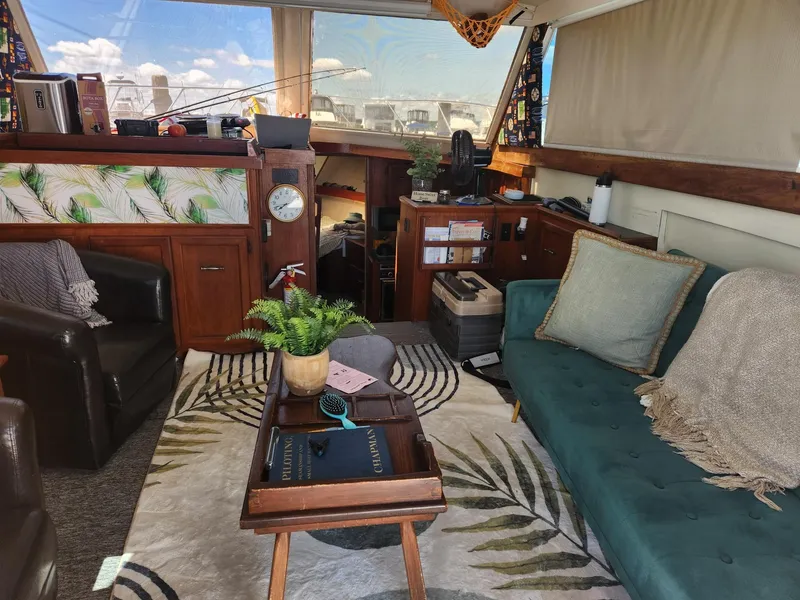 Slide: The Image of Interior of a 1977 Pacemaker 40 Sportfisherman with cozy seating and nautical decor. - 11