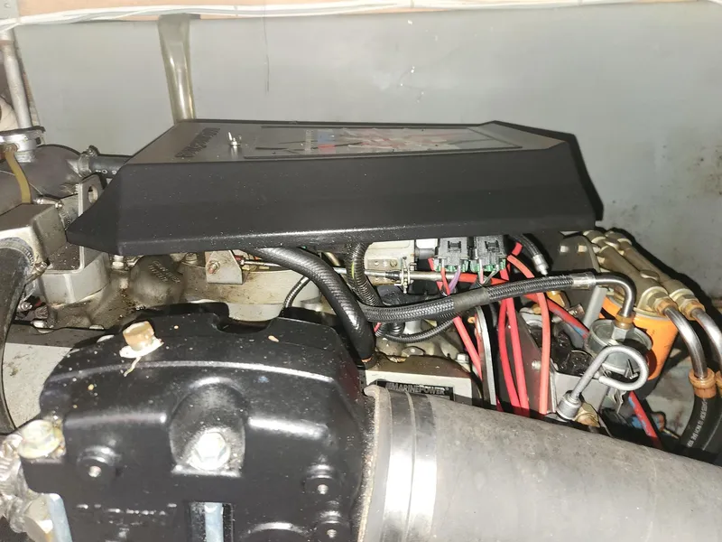 Slide: The Image of Engine compartment of a 1977 Pacemaker 40 Sportfisherman boat, showing wiring and components. - 24