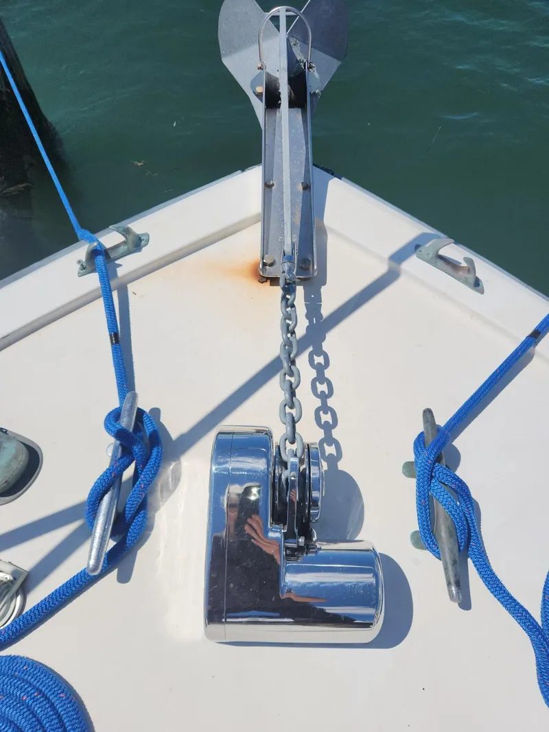 Slide: The Image of 1977 Pacemaker 40 Sportfisherman boat anchor and chain with blue ropes. - 26