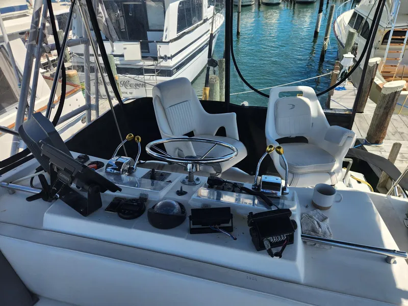 Slide: The Image of Cockpit of a 1977 Pacemaker 40 Sportfisherman with steering wheel and controls. - 8