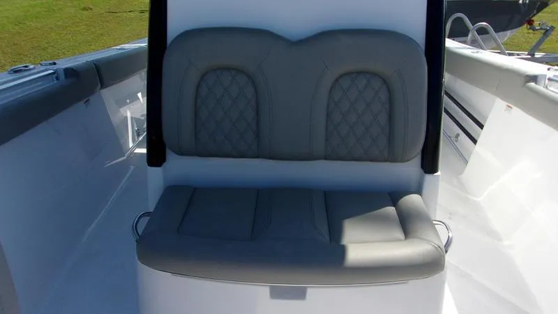 Slide: The Image of 2025 Sportsman Open 302 boat seat with cushioned backrest and sleek design. - 12