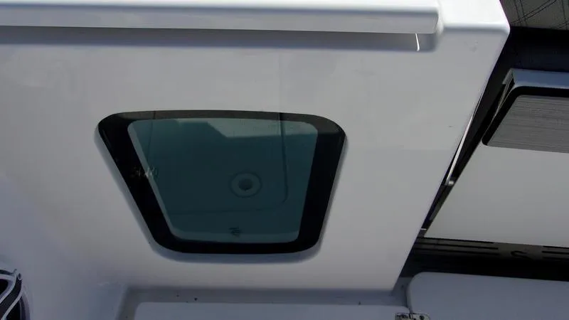 Slide: The Image of 2025 Sportsman Open 302 boat hatch detail, showcasing sleek design and functionality. - 2