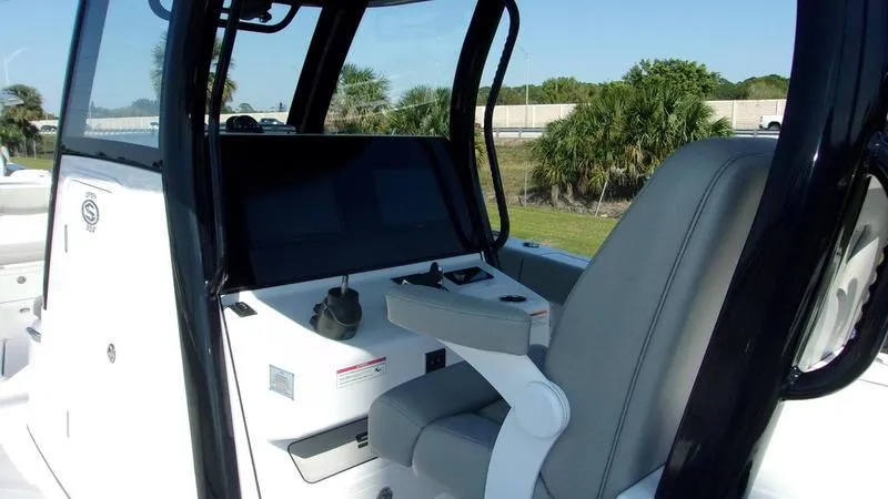 Slide: The Image of 2025 Sportsman Open 302 boat cockpit with modern controls and seating. - 7