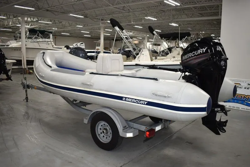 Slide: The Image of 2018 Mercury 460 Ocean Runner Rib Inflatable boat on trailer in showroom. - 1