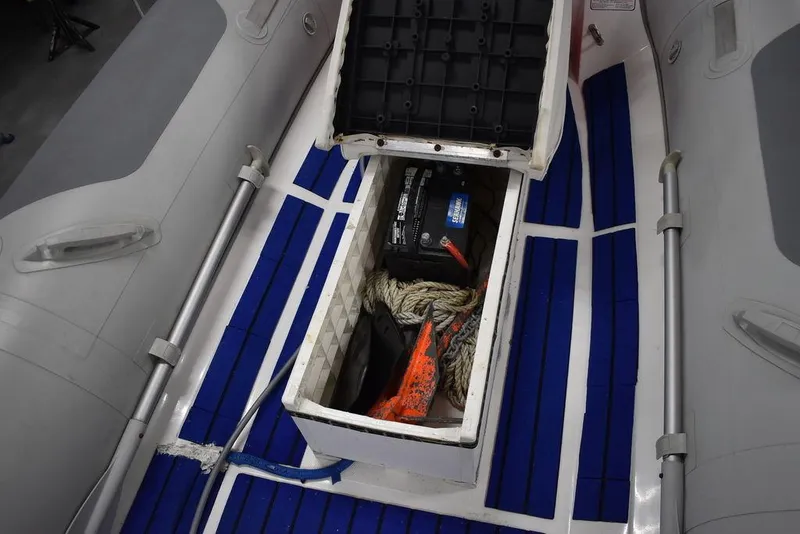 Slide: The Image of 2018 Mercury 460 Ocean Runner Rib Inflatable boat interior with open storage compartment. - 13