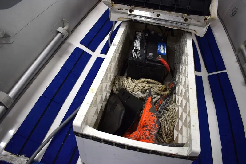 Slide: The Image of 2018 Mercury 460 Ocean Runner Rib Inflatable storage compartment with battery and rope. - 14