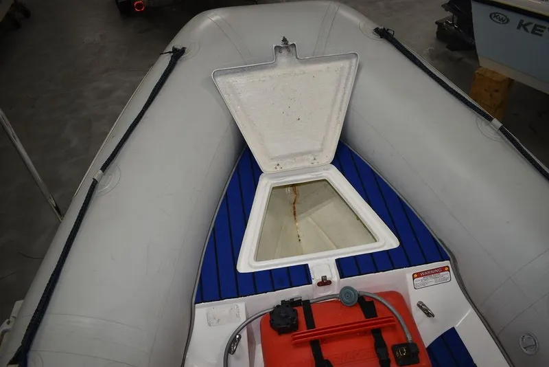 Slide: The Image of 2018 Mercury 460 Ocean Runner Rib Inflatable boat with open storage compartment. - 15