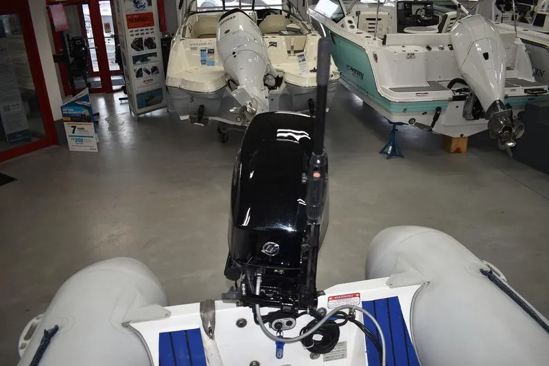 Slide: The Image of 2018 Mercury 460 Ocean Runner Rib Inflatable boat in showroom, featuring outboard motor. - 16