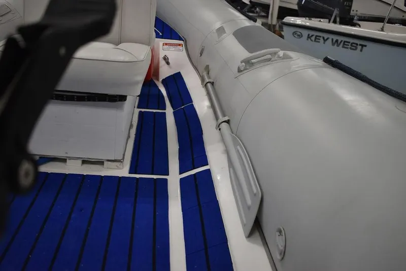 Slide: The Image of 2018 Mercury 460 Ocean Runner Rib Inflatable with blue deck flooring. - 19