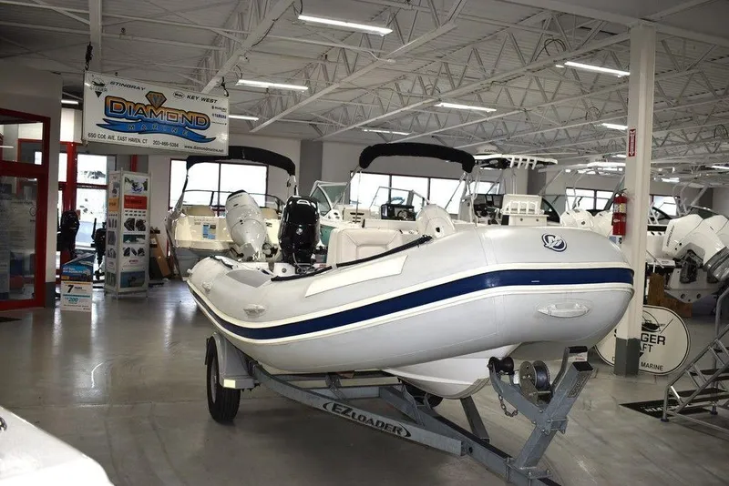 Slide: The Image of 2018 Mercury 460 Ocean Runner Rib Inflatable boat displayed in showroom. - 2